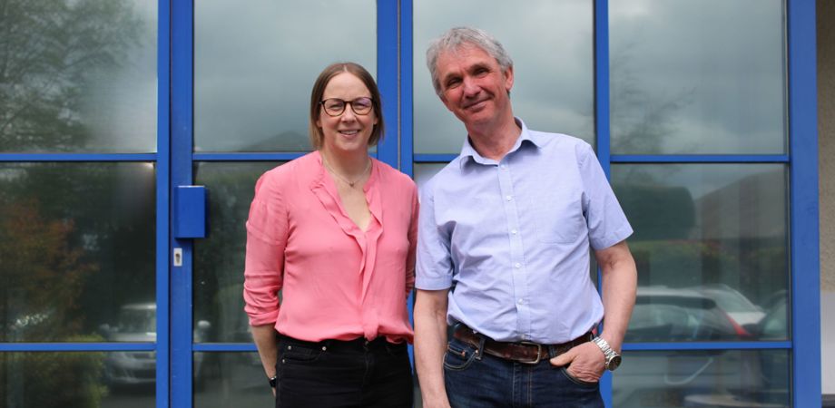 A photo of Catriona Watt and Chris Gledhill outside the PDMS office