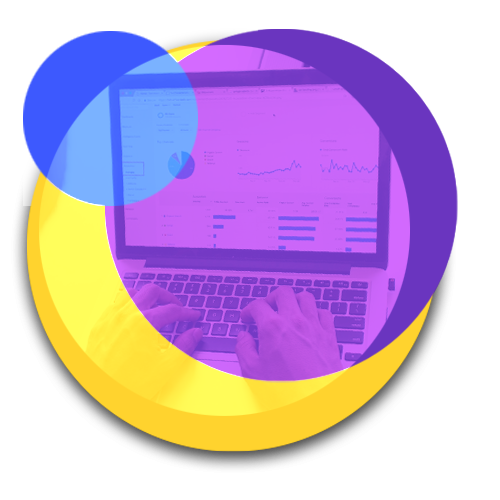 circular image of two hands typing on a laptop displaying analytics graphs on the screen