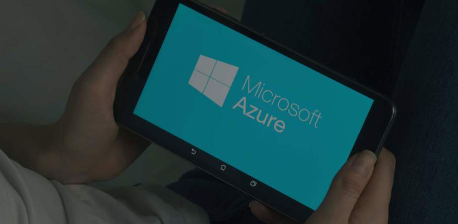 Man holding mobile device logging in to Azure