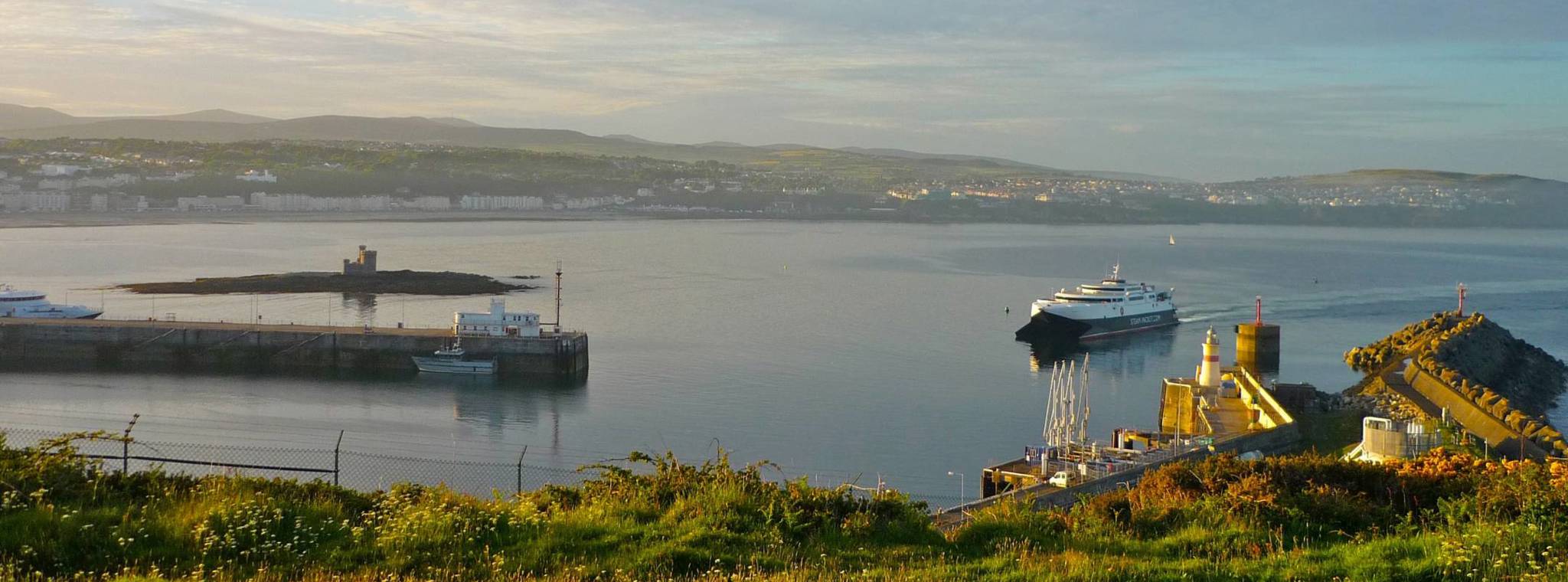 An image of Douglas Bay with the ferry arriving in the harbour