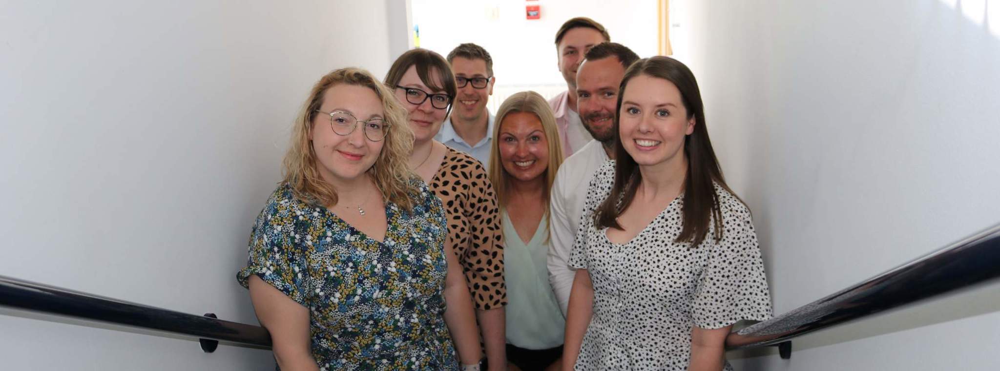 A photo of the new starters with Head of People & Culture, Charlotte Cain, inside the office
