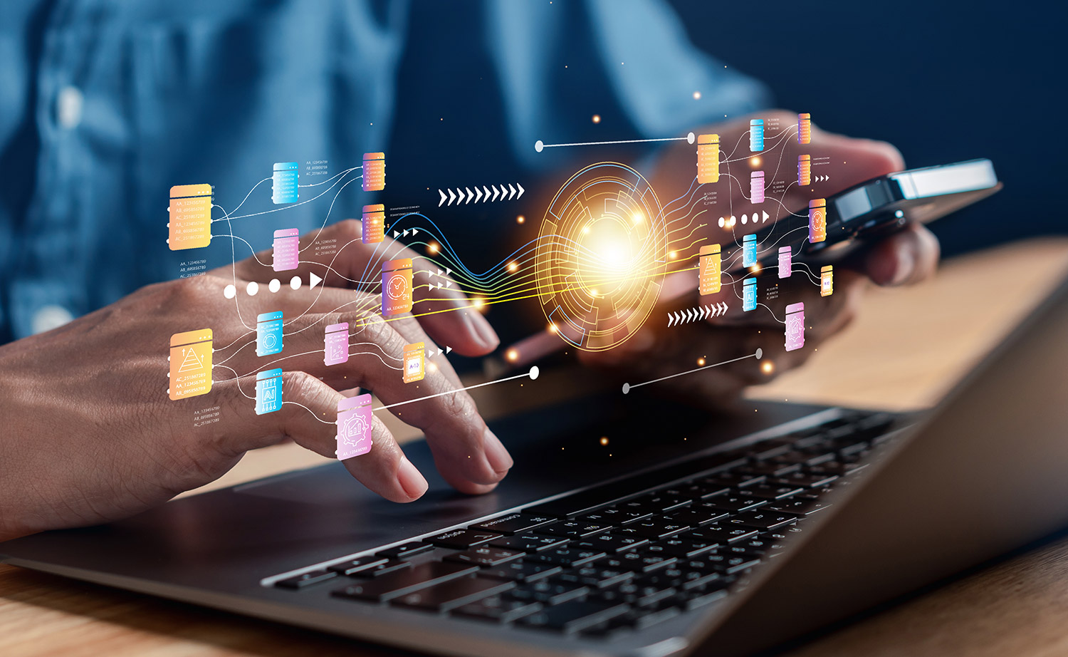 Concept of man using a laptop and smartphone for data analytics