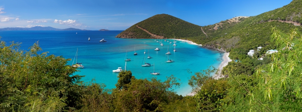 A panoramic photo of a bay of boats in the British Virgin Islands 
