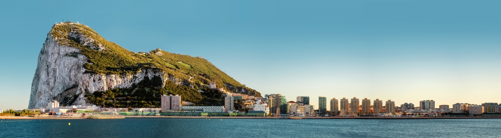 A panoramic view of the rock of Gibraltar alongside the city skyline