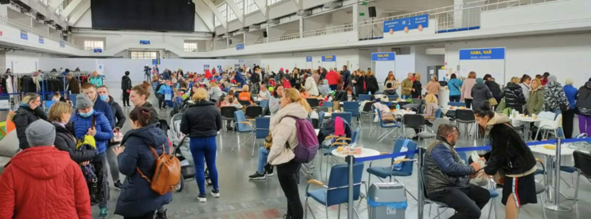 Communal area in Polish refugee shelter where refugees can get food, clothes and information