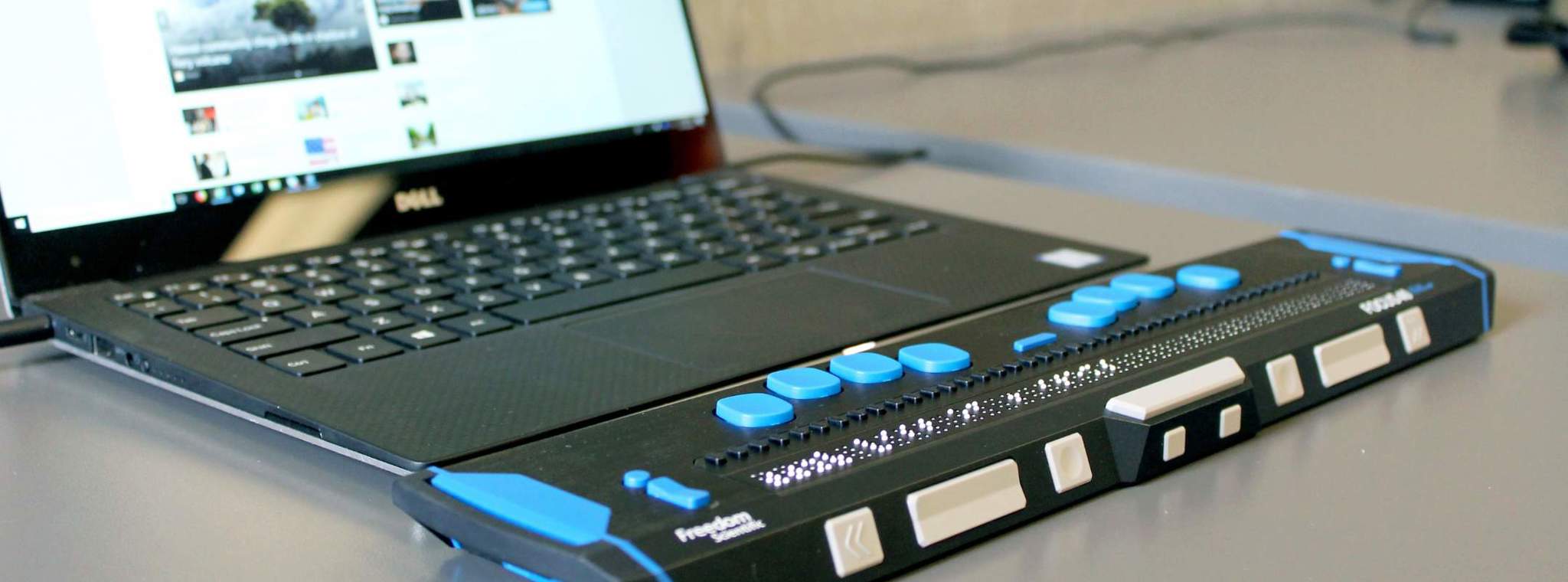 A computer with a refreshable braille display