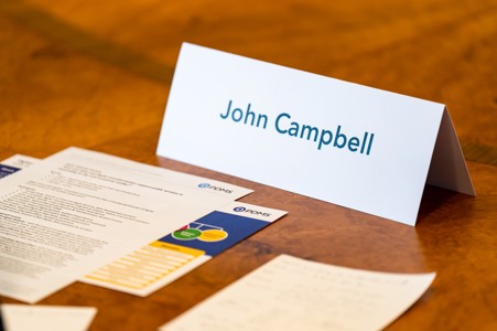 John Campbell's name card and handouts