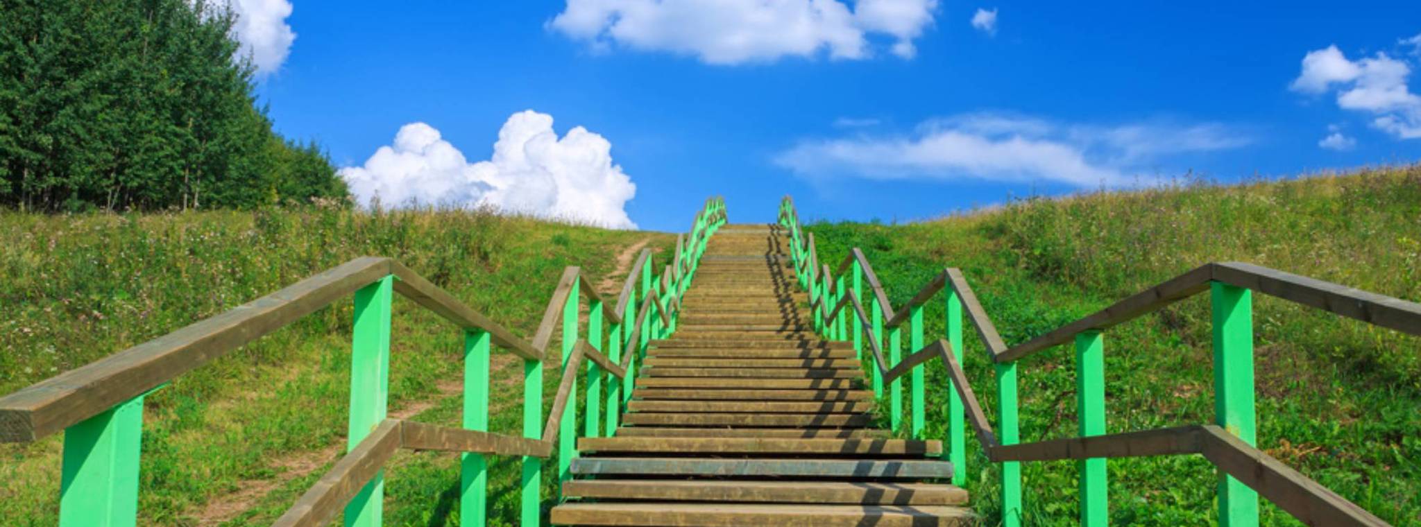 An image of stairs leading to a sky with clouds in the sky