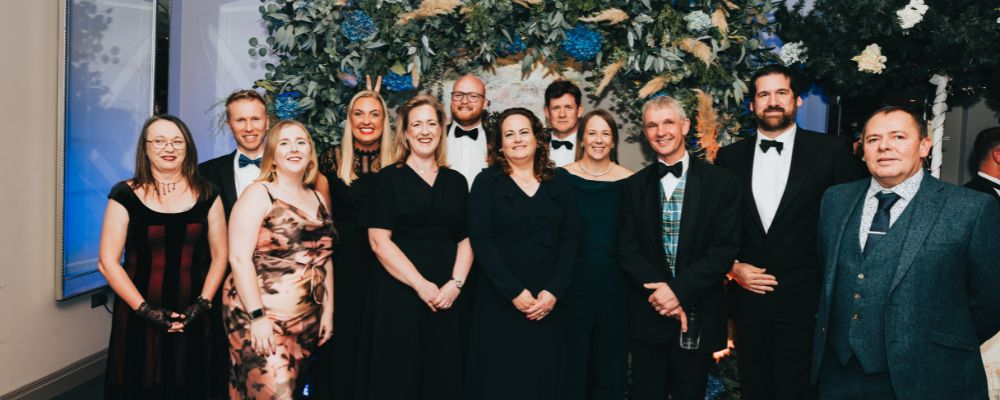 PDMS staff and clients posing for a photo at the IOM Chamber Gala Dinner