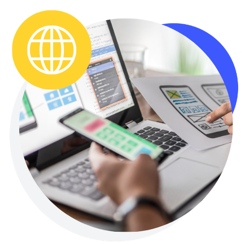 An icon of website designers and developers looking at code and wireframes for a new website