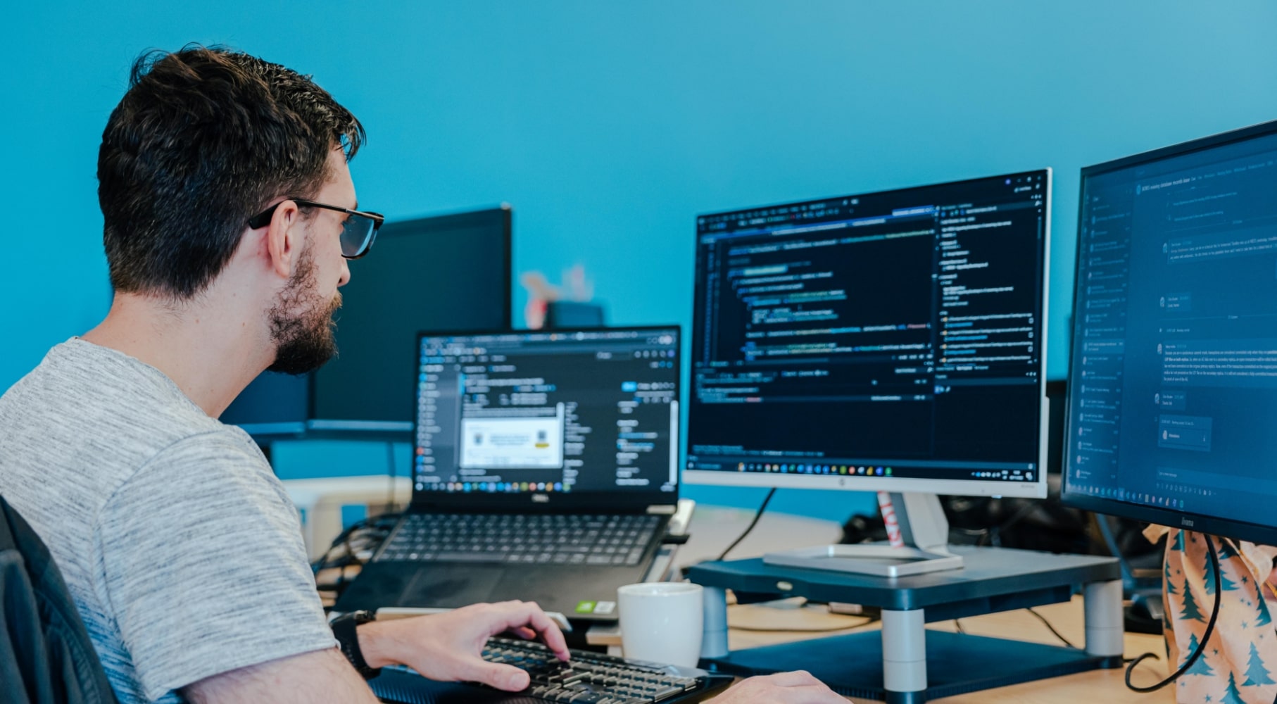 Developer at a desk with a computer screen with code