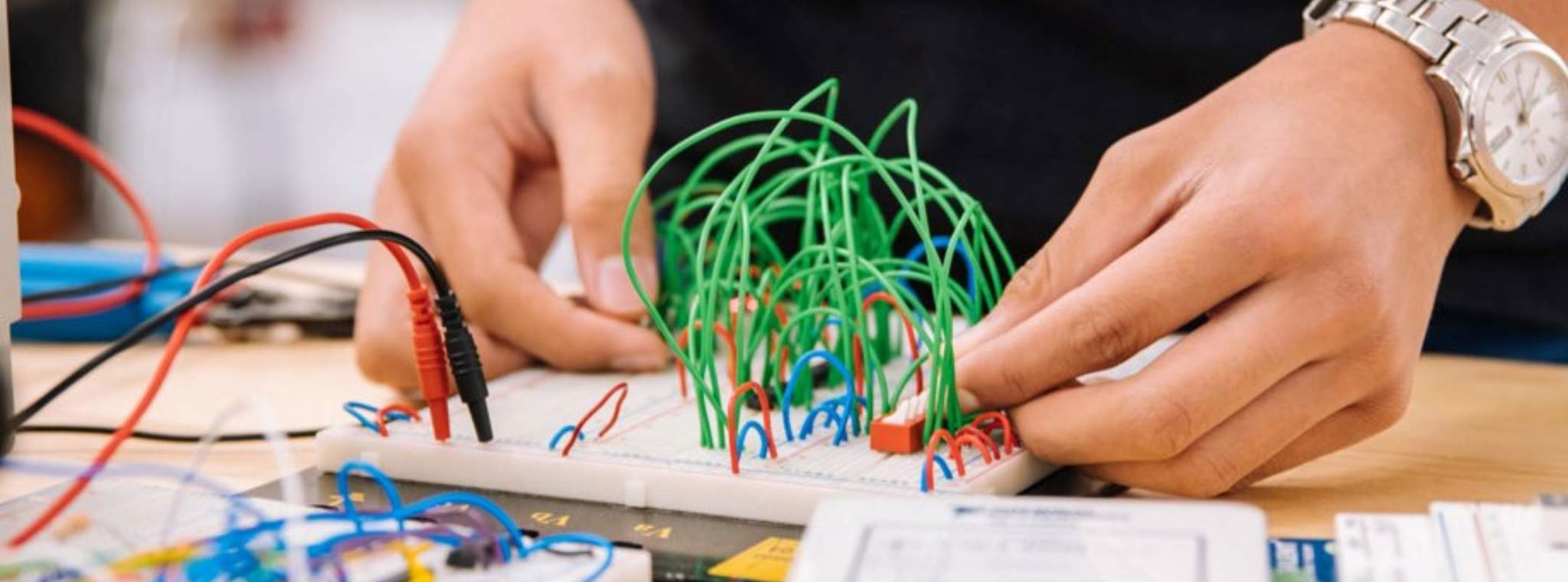 An image of a female working on a circuit board
