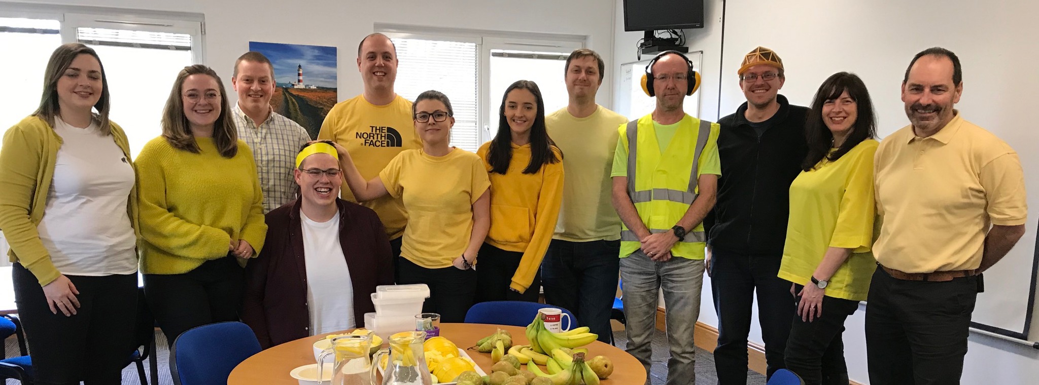 Staff wearing yellow clothing to celebrate Dress in Yellow Day