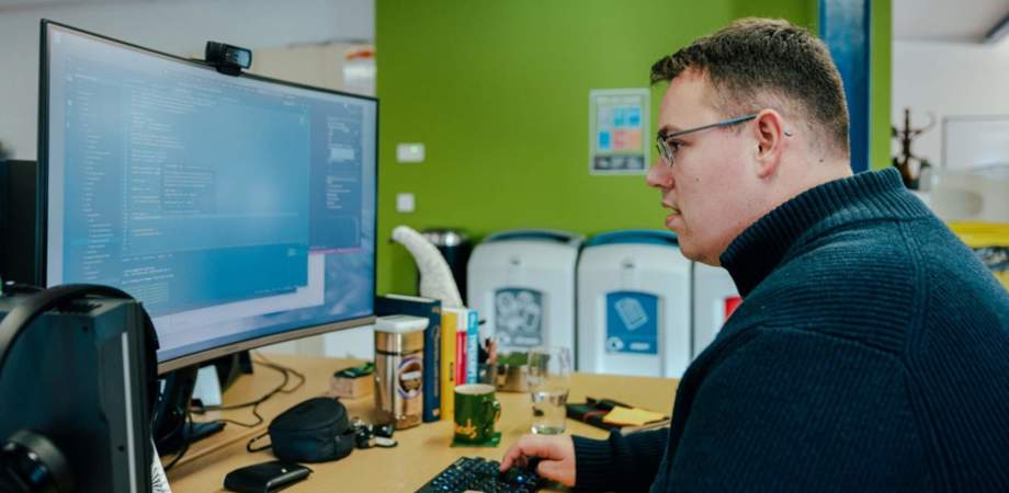 Photo of Senior Front-End Developer Nick Collins doing coding on a computer screen