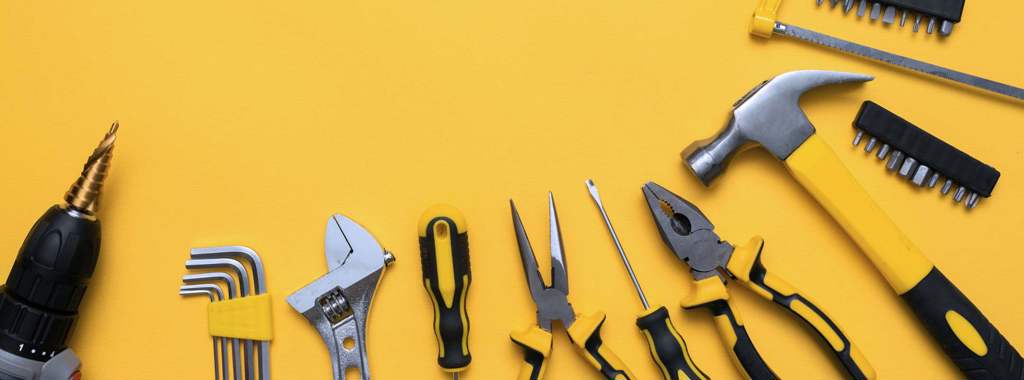 Yellow tools on a yellow background