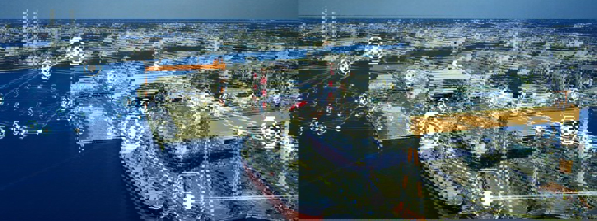 Modern shipyard aerial view with an overlay of interconnected digital icons