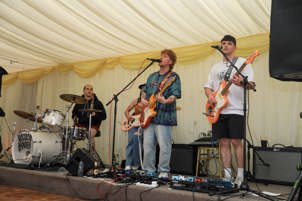 Band Voodoo Bandits performing inside the marquee at PDMS Fest
