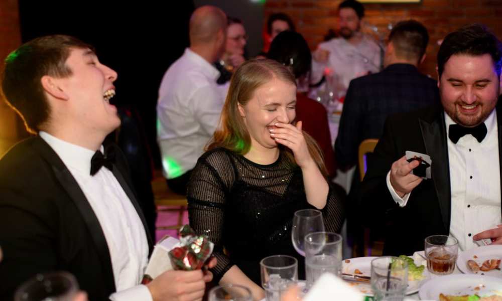 PDMS staff members laughing in formal wear