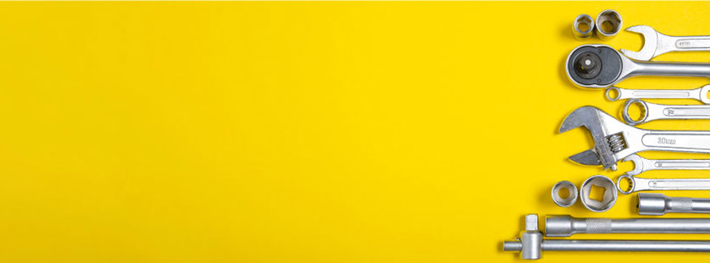 An image of a variety of different tools on a yellow background