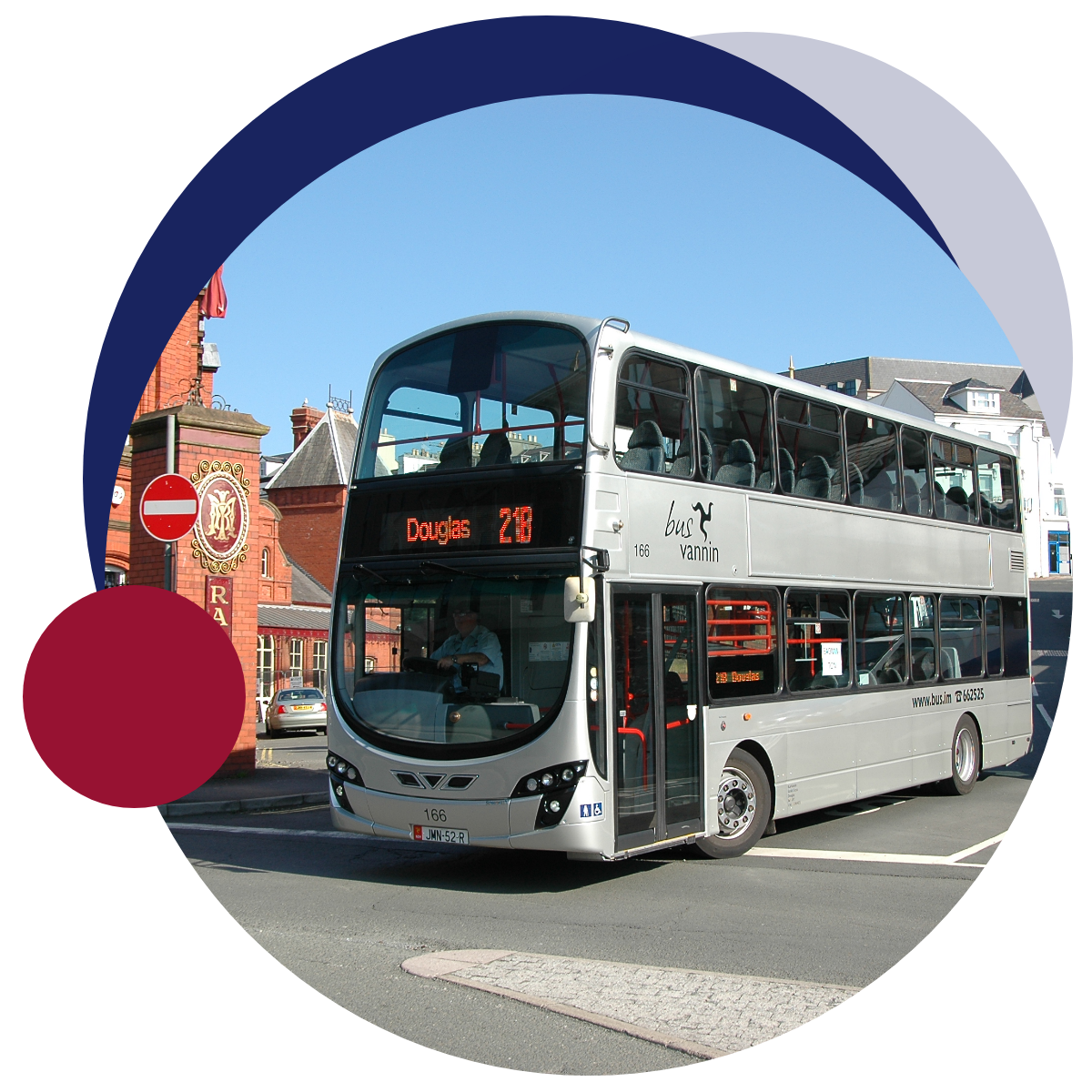 An image of a double decker IOM bus on the road