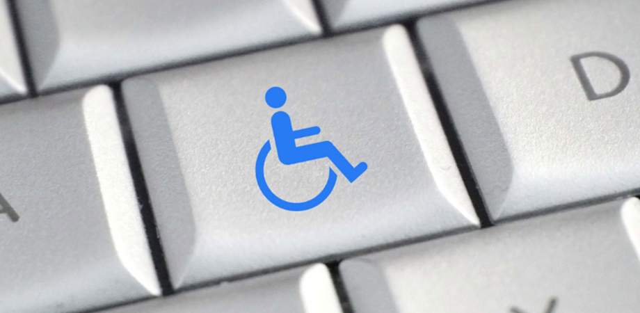 Disability icon in blue on a computer keyboard