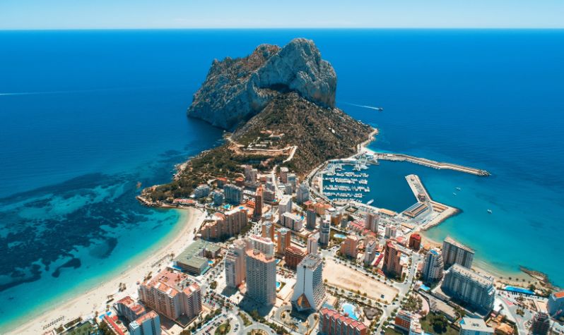 An aerial photo of Calpe, Gibraltar looking out to the Strait of Gibraltar in the background