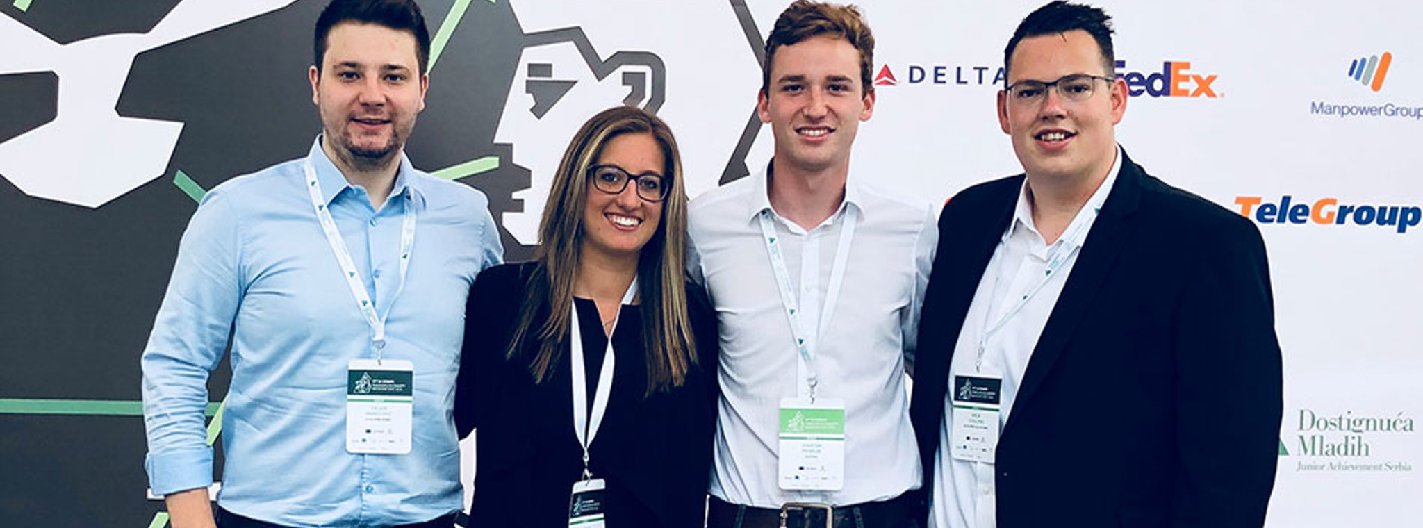 A photo of Nick with three other members of the JA judging panel 