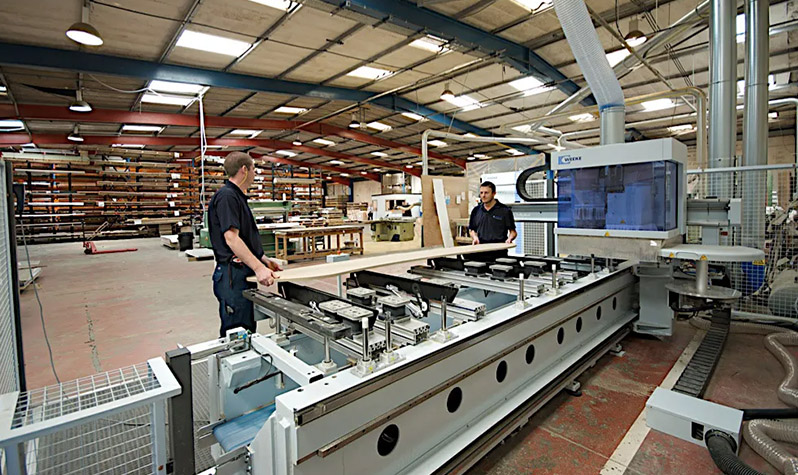 Two men working in Rearo manufacturing facility