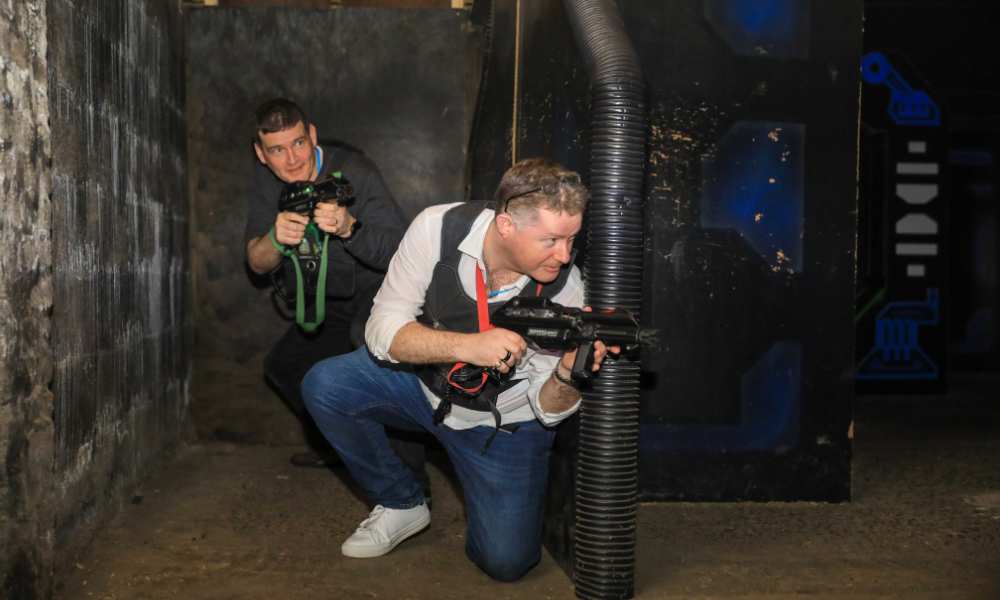 PDMS staff playing laser tag 
