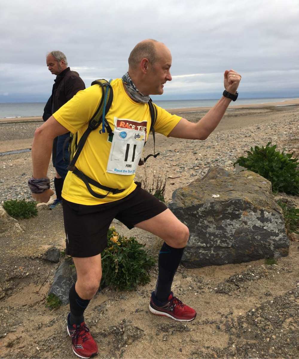 Lewis Veale posing on the beach for Race the Sun