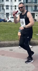 Photo of Jonathan Callaghan running on Douglas promenade for Race the Sun