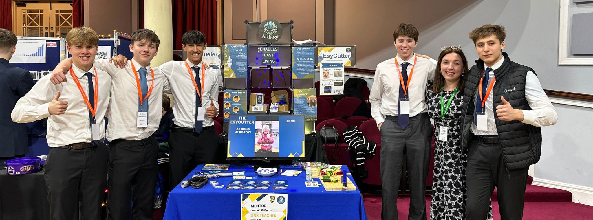 A photo of the ArthEsy team at their trade stand - L-R: Guy, Isaac, Oli, Jacob, Hannah, Shenton