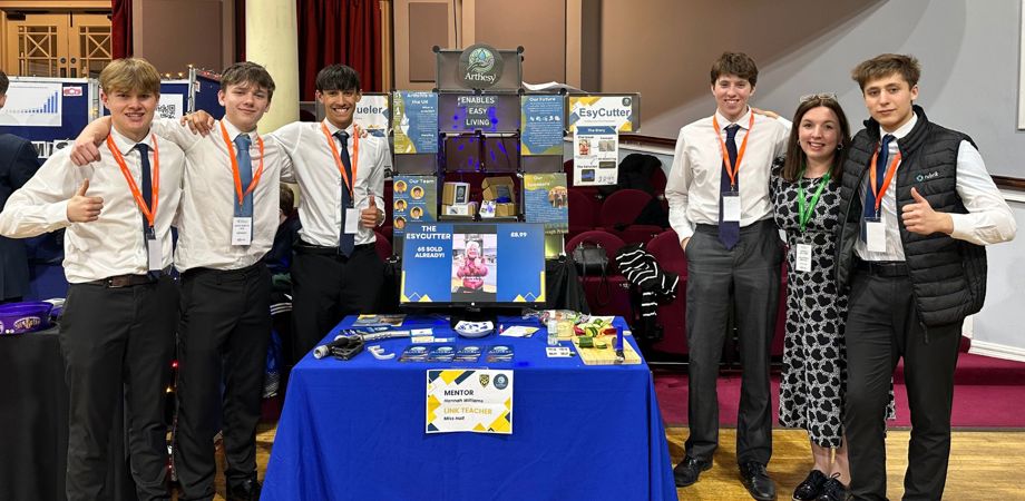 A photo of the ArthEsy team at their trade stand - L-R: Guy, Isaac, Oli, Jacob, Hannah, Shenton